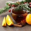 cup of tea with anise, cinnamon and citrus fruits winter drink, Christmas decorations